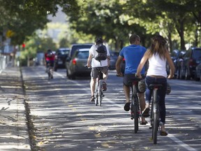 Cyclists travel north on Brébeuf St. near Laurier Ave.