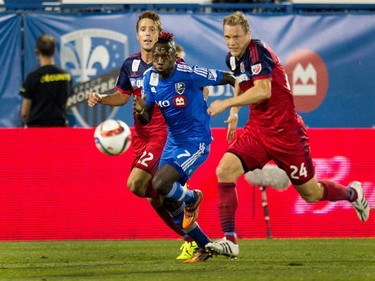 Montreal Impact forward Dominic Oduro, centre, advances the ball as Chicago Fire defender Patrick Doody, left, and Chicago Fire defender Ty Harden follow him during MLS action at Saputo Stadium in Montreal on Wednesday September 23, 2015.