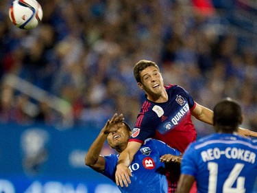 Montreal Impact midfielder Johan Venegas, left, is blocked from getting to the ball by an unidentified Chicago Fire player as Montreal Impact midfielder Nigel Reo-Coker looks on during MLS action at Saputo Stadium in Montreal on Wednesday September 23, 2015.