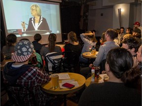 A full house of apolitical youth attends the screening of the federal political party leaders debate presented by Force Jeunesse, as it is televised at Bar Medley Simple Malt Thursday, September 24, 2015.