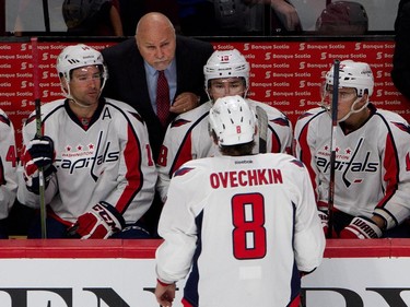 Washington Capitals head coach Barry Trotz listens to Washington Capitals left wing Alex Ovechkin during NHL pre-season action against the Montreal Canadiens  in Montreal on Thursday September 24, 2015.