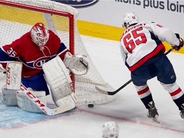 Washington Capitals left wing Andre Burakovsky can't find open net as Montreal Canadiens goalie Dustin Tokarski covers up during NHL pre-season action in Montreal on Thursday September 24, 2015.