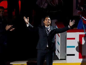 Francis Bouillon blows a kiss to the crowd as the Montreal Canadiens announce his retirement from active play during NHL pre-season action against the Chicago Blackhawks  in Montreal on Friday September 25, 2015.