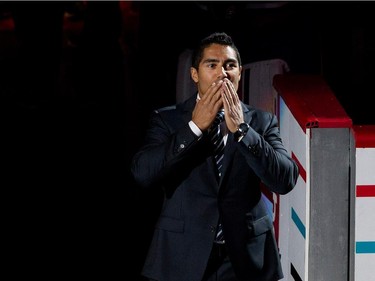 Francis Bouillon blows a kiss to the crowd as the Montreal Canadiens announce his retirement from active play during NHL pre-season action against the Chicago Blackhawks in Montreal on Friday September 25, 2015.