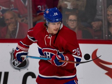 Montreal Canadiens Nathan  Beaulieu juggles puck during the pre-game warmup NHL pre-season action against the Chicago Blackhawks in Montreal on Friday September 25, 2015.