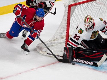 Montreal Canadiens Nicolas Blanchard tries a wrap around as Chicago Blackhawks goalie Scott Darling deflects the puck during NHL pre-season action in Montreal on Friday September 25, 2015.