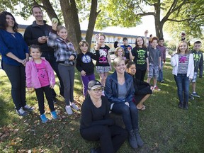 Tanya van Blokland, front in the centre, with students and parents in from St. Paul School in Beaconsfield. Blockland is planning to make a human chain around the school in support of the teachers contract talks. (Peter McCabe / MONTREAL GAZETTE)