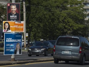 Campaign posters on St- Jean Blvd. in Dollard-des-Ormeaux, in the riding Pierrefonds-Dollard, Sunday, September 27, 2015. (Peter McCabe / MONTREAL GAZETTE)