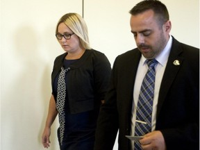 Isabelle Gaston leaves a courtroom at the St-Jérôme courthouse on Tuesday Sept. 29, 2015.  She was testifying at the new murder trial of her former husband, former cardiologist Guy Turcotte, who is on trial for the killing of their two children.