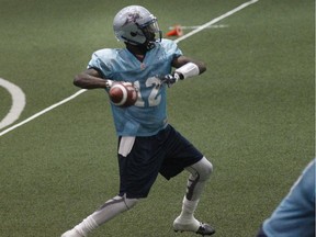 Alouettes quarterback Rakeem Cato prepares to throw pass during practice at the Bell Sports Complex in Brossard on Sept. 29, 2015.