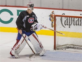 Canadiens goalie Carey Price uses a shovel to clear snow from his crease during practice at the Bell Sports Complex in Brossard on Sept. 30, 2015.