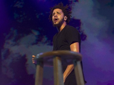 Hip-hop artist J. Cole looks out at the crowd at the Bell Centre in Montreal Friday, September 4, 2015 as he walks behind a stool. His most recent studio album is 2014 Forest Hills Drive.