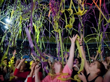 Fans are showered with streamers during a One Direction concert  band p at the Olympic Stadium in Montreal on Saturday September 5, 2015.