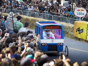 Montreal métro inspired  boxcar rolls down Beaver Hall at the Red Bull soapbox derby  in Montreal on Sunday, September 6, 2015.