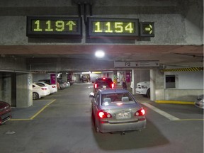 Electronic signs at the parking lot for the MUHC Glen campus indicate where parking spots are available.