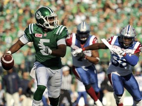 Saskatchewan Roughriders' quarterback Kevin Glenn works under pressure from the Montreal Alouettes during first-half CFL action in Regina on Sunday, Sept. 27, 2015. THE CANADIAN PRESS/Mark Taylor