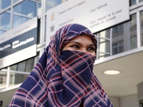 Zunera Ishaq talks to reporters outside the Federal Court of Appeal after her case was heard on whether she can wear a niqab while taking her citizenship oath, in Ottawa on Tuesday, Sept. 15, 2015.