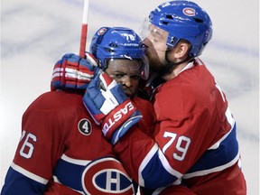 Montreal Canadiens defenseman P.K. Subban (76) gets a kiss from teammate Andrei Markov after scoring the second goal against the Ottawa Senators during second period of Game 2 NHL first round playoff hockey action Friday, April 17, 2015 in Montreal.THE CANADIAN PRESS/Ryan Remiorz