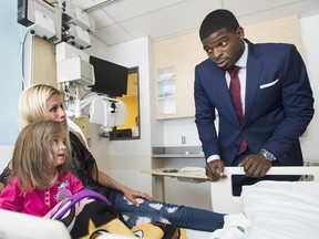 Montreal Canadiens defenceman P.K. Subban meets a young patient and her mother following a press conference at the Children's Hospital in Montreal, Wednesday, September 16, 2015, where he announced that his foundation would pledge $10-million to the hospital over the next seven years.