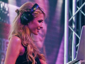 Paris Hilton takes the role of a DJ during the Fast Fashion Show in Lodz, Poland, Aug. 28, 2015.