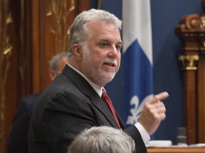 Quebec Premier Philippe Couillard responds to the Opposition during question period as the legislature resumes for its fall session, Tuesday, Sept. 15, 2015 at the National Assembly in Quebec City.