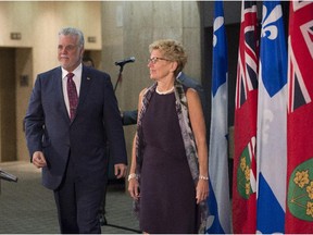 "When Quebec and Ontario work together, everyone wins," said Quebec Premier Philippe Couillard, left, at a joint cabinet meeting with Ontario Premier Kathleen Wynne on Friday.