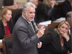 Quebec Premier Philippe Couillard responds to the Opposition during question period, Wednesday, Sept. 23, 2015 at the legislature in Quebec City.