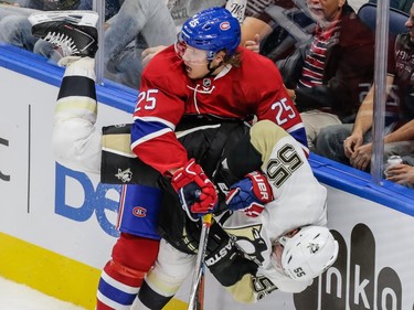 Montreal Canadiens left wing Jacob De La Rose collides with Pittsburgh Penguins defenceman Sergei Gonchar during the second period of their preseason NHL match at the Centre Vidéotron in Quebec City on Monday, Sept. 28, 2015.