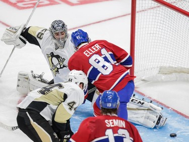 Montreal Canadiens centre Lars Eller, centre, scores on Pittsburgh Penguins goalie Marc-Andre Fleury during the second period of their preseason NHL match at the Centre Vidéotron in Quebec City on Monday, Sept. 28, 2015.