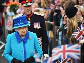 Queen Elizabeth II opens Newtongrange Station after arriving on the steam locomotive the Union of South Africa on September 9, 2015 in Newtongrange , Scotland. Today, Her Majesty Queen Elizabeth II becomes the longest reigning monarch in British history overtaking her great-great grandmother Queen Victoria's record by one day. The Queen has reigned for a total of 63 years and 217 days. Accompanied by her husband The Duke of Edinburgh, she has today opened the new Scottish Borders Railway.