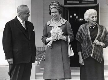 The Queen visits Lieutenant-Governor Paul Comtois at his residence, Bois de Coulonge, west of Quebec City in 1964. At right is Mrs. Comtois.