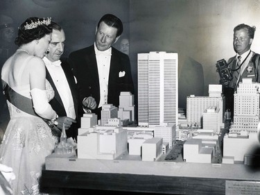 The Queen views a model of Place Ville Marie with Mayor Fournier and Donald Mumford, general manager of the Queen Elizabeth Hotel, June 16, 1959.