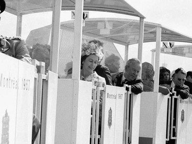 Her Majesty Queen Elizabeth II and Prime Minister of Canada Lester B. Pearson ride the minirail at Expo 67.