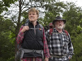 Robert Redford, left, as Bill Bryson, and Nick Nolte as Stephen Katz,  stumble in A Walk in the Woods.