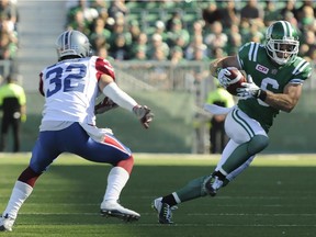 Saskatchewan Roughriders' wide receiver Rob Bagg, right, picks up yards against the Montreal Alouettes during first half CFL action in Regina on Sunday, Sept. 27, 2015.
