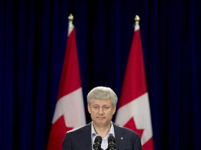 Conservative leader Stephen Harper takes questions from the media following a question and answer session with the Ontario Chamber of Commerce during a campaign stop in Welland, Ont., on Wednesday, September 9, 2015.