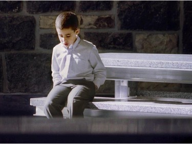 David Saber, son of Jaan Saber, Concordia professor killed by Valeri Fabrikant, sits at one of the memorial tables during dedication ceremony at the Hall Building October 11, 1996.