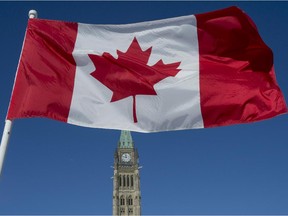 The Canadian Flag flies over the Peace Tower on Parliament Hill.