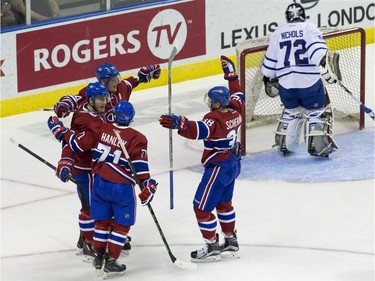 The Montreal Canadiens celebrate a second period goal against Toronto Maple Leafs goaltender Justin Nichols during their NHL Rookie Tournament hockey game at Budweiser Gardens in London, Ont., on Saturday, September 12, 2015.