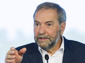 NDP leader Thomas Mulcair speaks to reporters during a federal election campaign stop in Brossard, Que., on Friday, September 4, 2015.