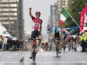 Tim Wellens from Belgium celebrates as he crosses the finish line in Montreal, Sunday, Sept. 13, 2015, to win the Grand Prix Cycliste de Montréal.