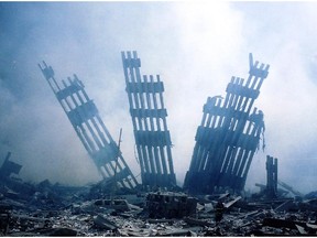 The rubble of the World Trade Center smoulders following a terrorist attack 11 Sept. 11, 2001, in New York.