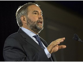 NDP leader Tom Mulcair addresses supporters during a campaign stop in Montreal on Wednesday, Sept. 23, 2015.