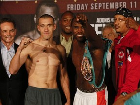Tommy "Kryptonite" Karpency stares down Adonis "Superman"  Stevenson during weigh-at the Ricoh Colliseum  in Toronto on Sept. 10, 2015.