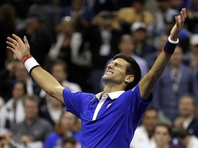 Novak Djokovic, of Serbia, reacts after defeating Roger Federer, of Switzerland, in the men's championship match of the U.S. Open tennis tournament, Sunday, Sept. 13, 2015, in New York.