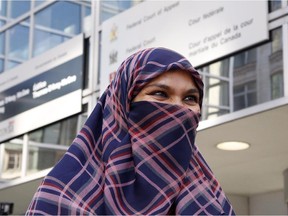 Zunera Ishaq talks to reporters outside the Federal Court of Appeal after her case was heard on whether she can wear a niqab while taking her citizenship oath, in Ottawa on Tuesday, September 15, 2015.