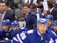 Toronto Maple Leafs head coach Mike Babcock stands behind the bench as his team plays the Montreal Canadiens in both teams' season-opener Oct. 7, 2015, at the Air Canada Centre.