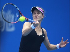 Eugenie Bouchard returns a ball against Andrea Petkovic of Germany at the China Open on October 5, 2015 in Beijing.