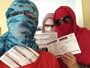 A photo of a group of disguised voters protesting the wearing of niqabs by voters. The photo is from the website Je Vote Voilée. (Facebook)