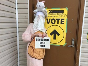 A voter in disguise prepares to enter a polling station in this photo from a Facebook page called "Any Mummers 'Lowed to Vote". The photo was posted by Crystal Martin. (Facebook)